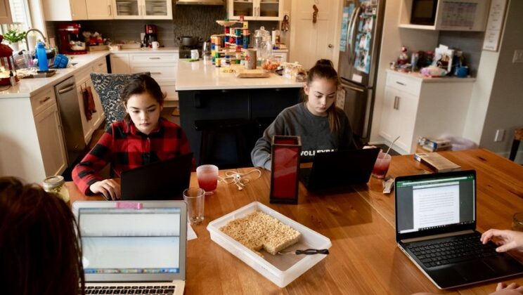 teens working on laptops