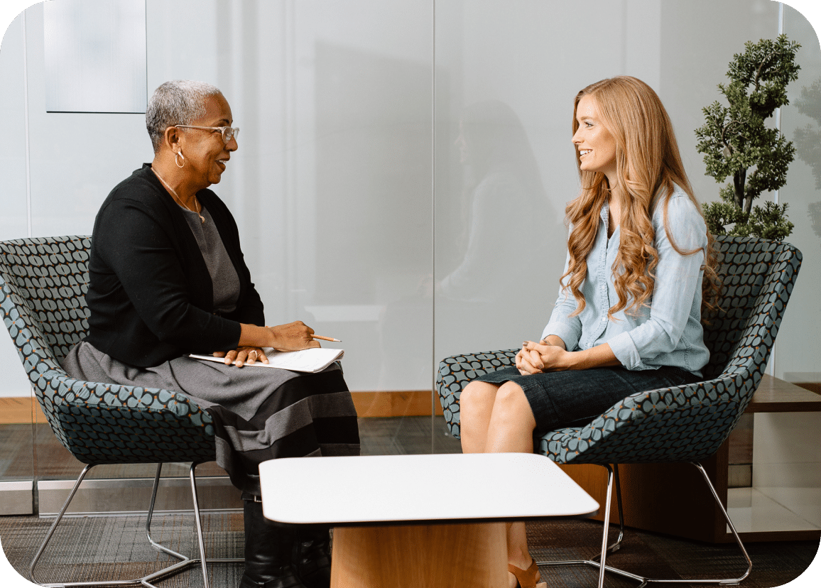 Two women in the middle of an in-person Lyra therapy session.